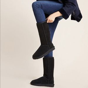 Tall black UGG boots